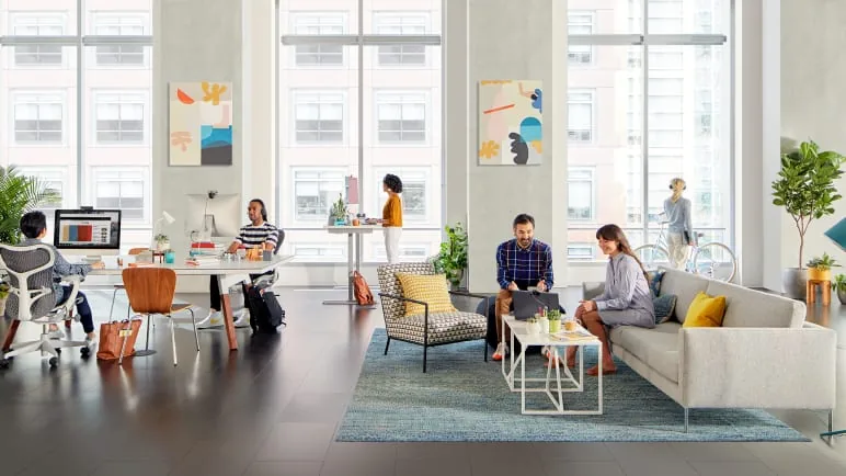 Open-plan office with collaborative lounge seating and workstations